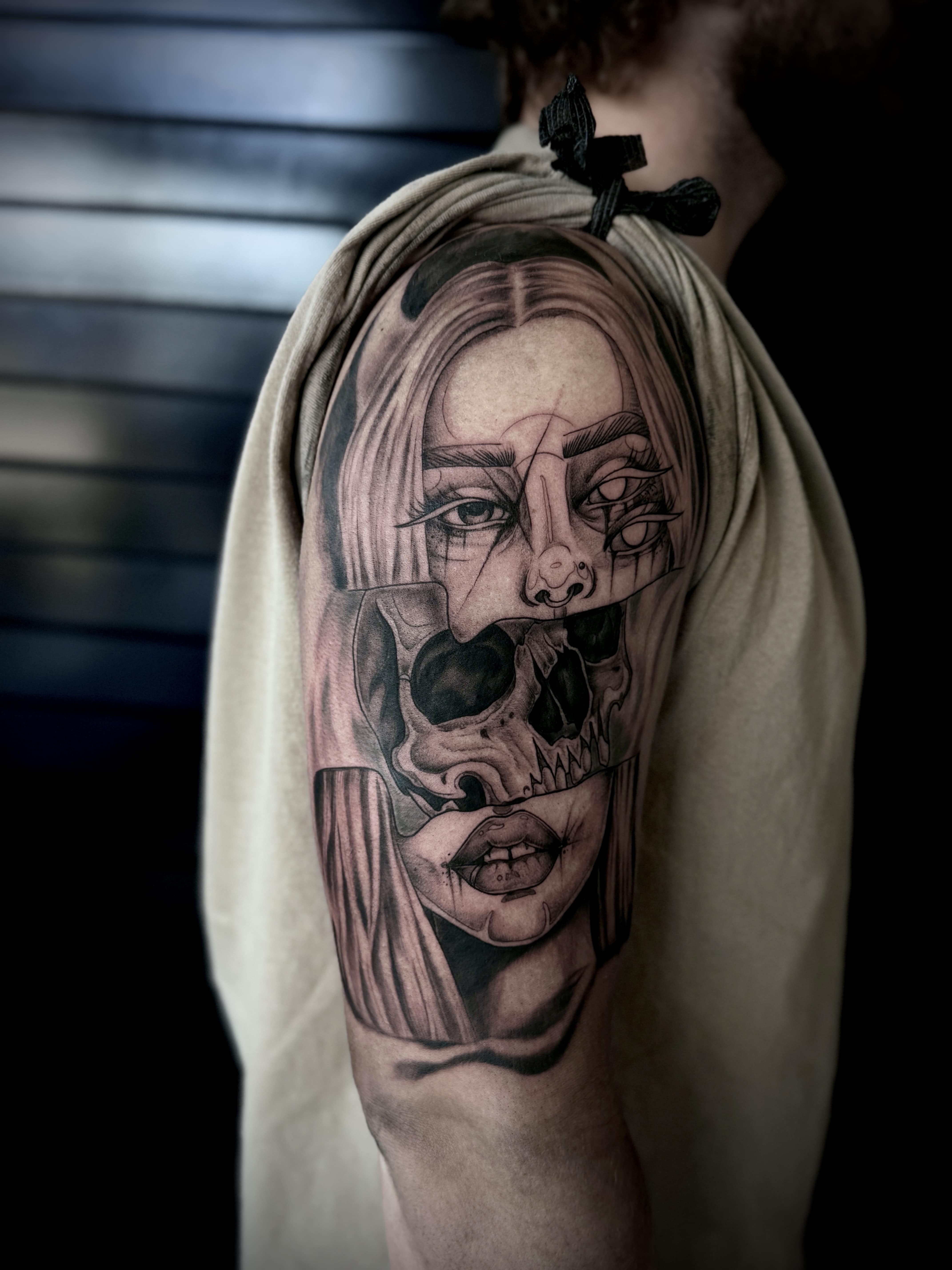 woman half sleeve tattoo with skull