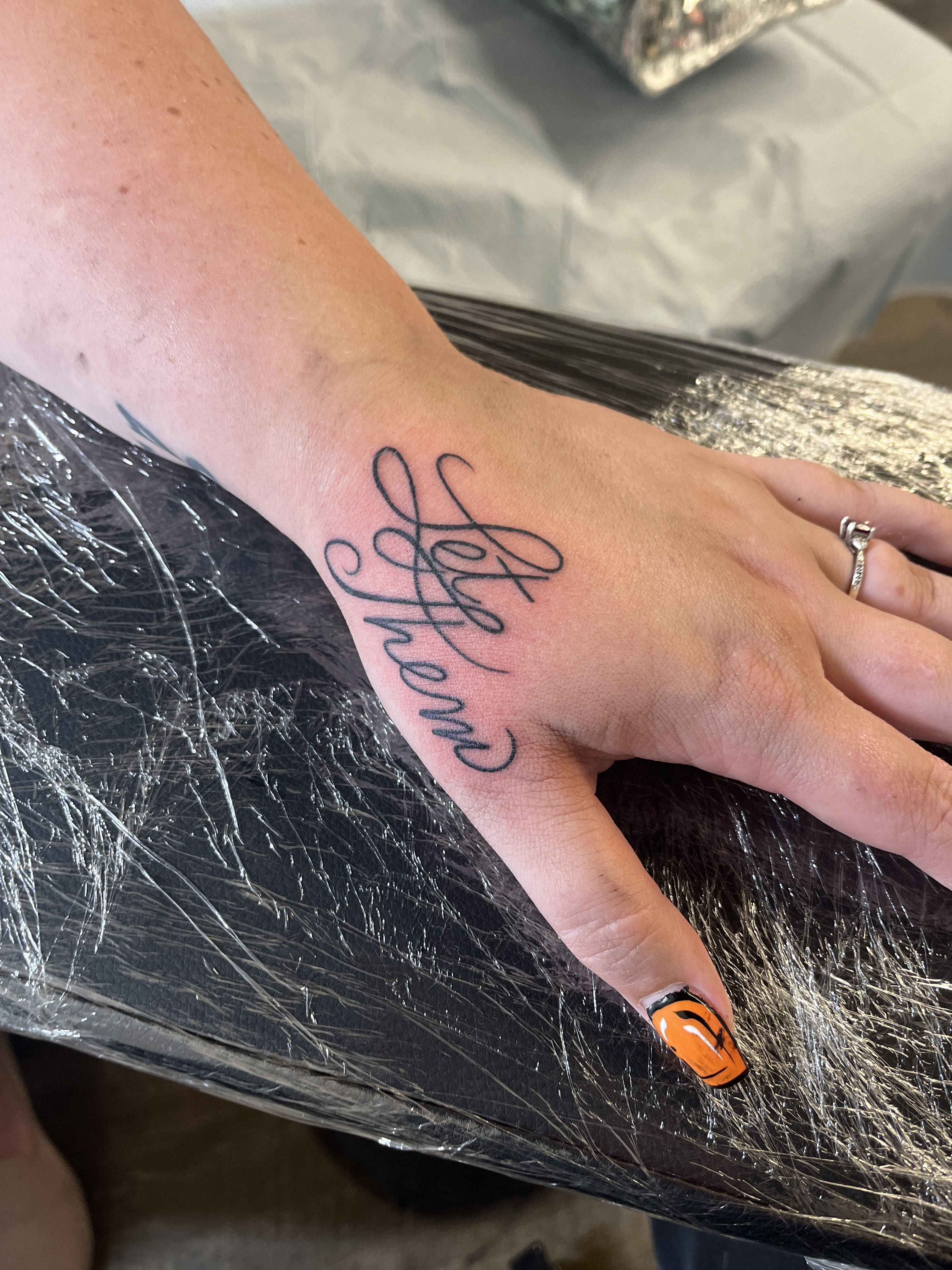 Script on Hand Tattoo