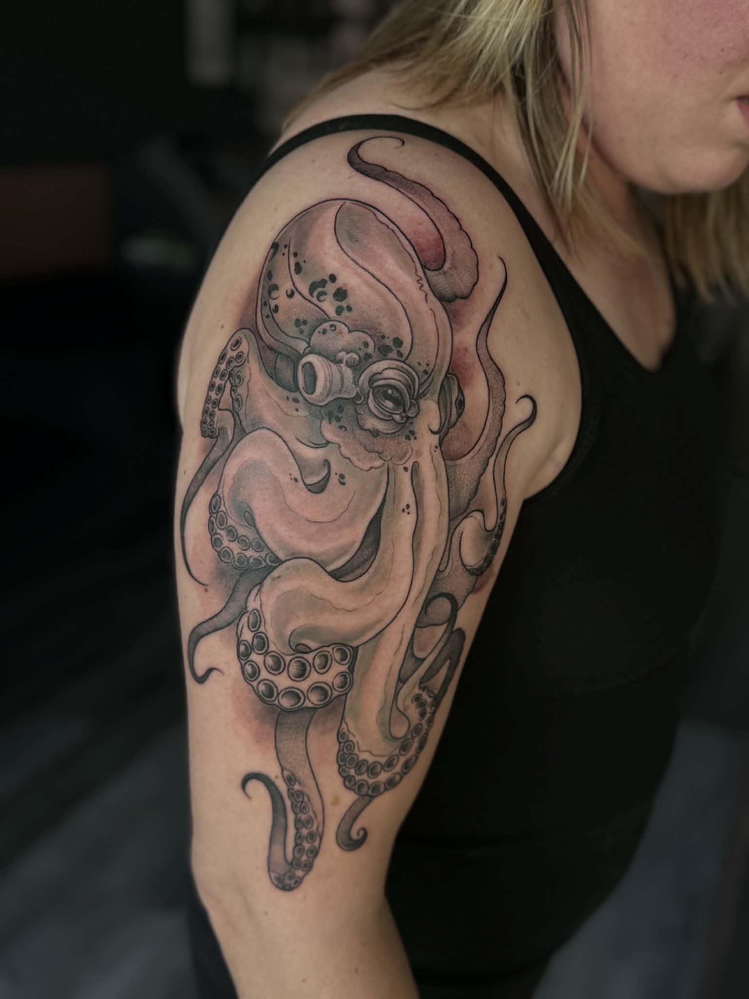 Detailed illustrative octopus tattoo in black and grey, showcasing custom shading and texture by AJ at Poking Hazard’s private skin-informed studio in Edmonton, AB.
